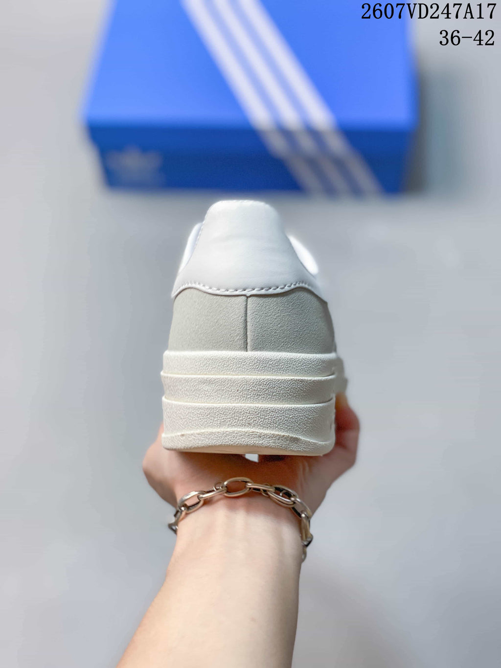Rear view of the sneaker showing the padded heel and layered raised sole.