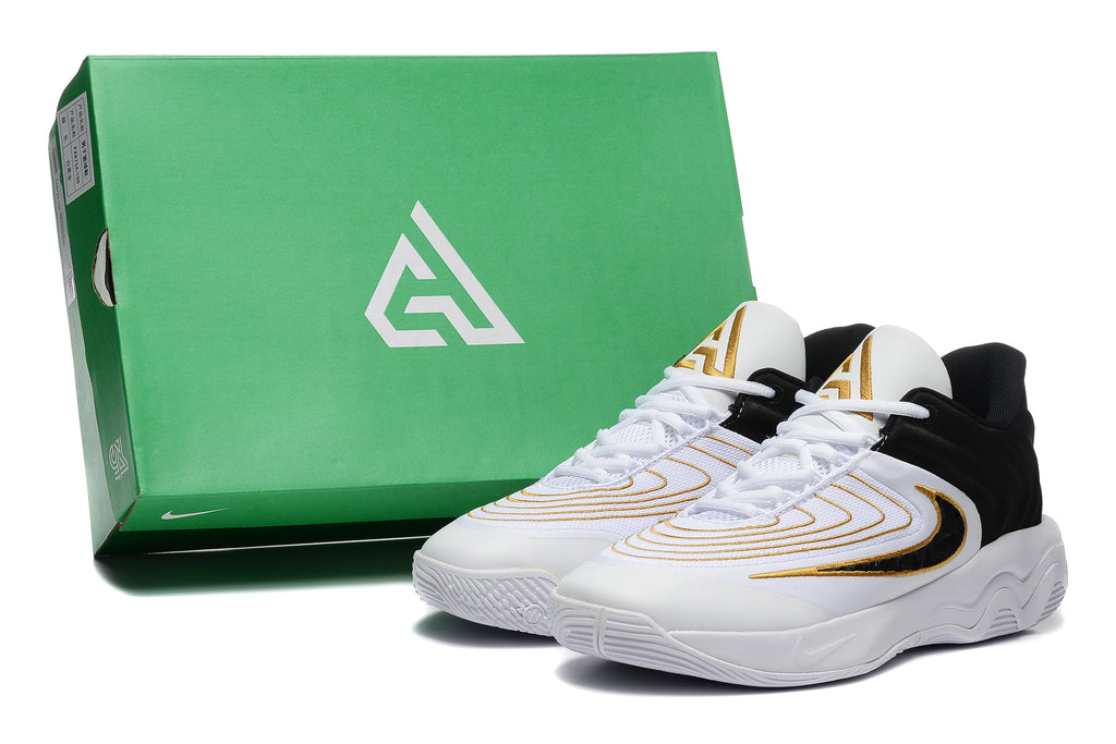 Nike Zoom Freak 5 basketball shoes pictured beside a green shoe box