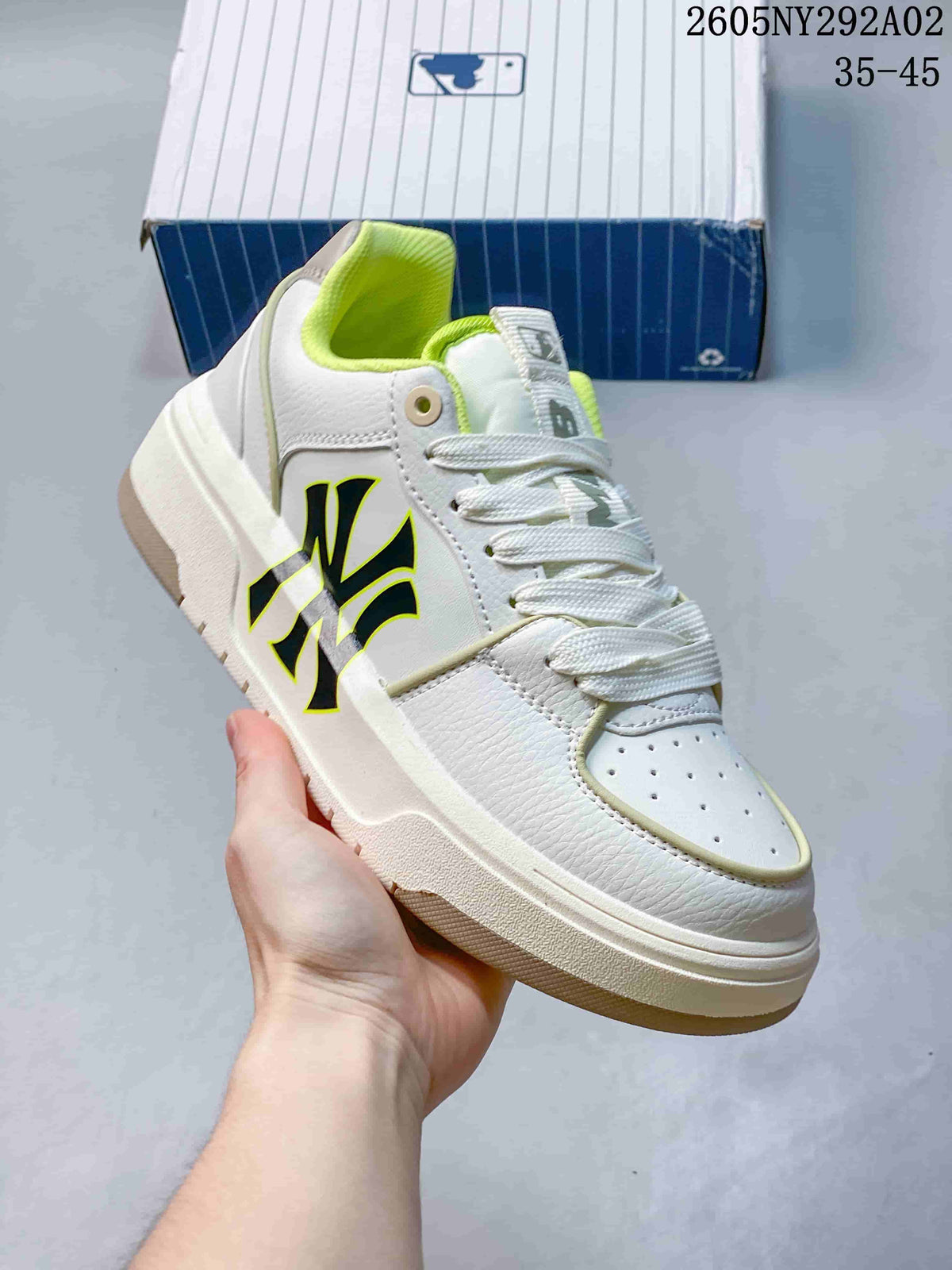 Close-up side view of a white MLB Chunky Liner sneaker with bright lime trim and collar lining.