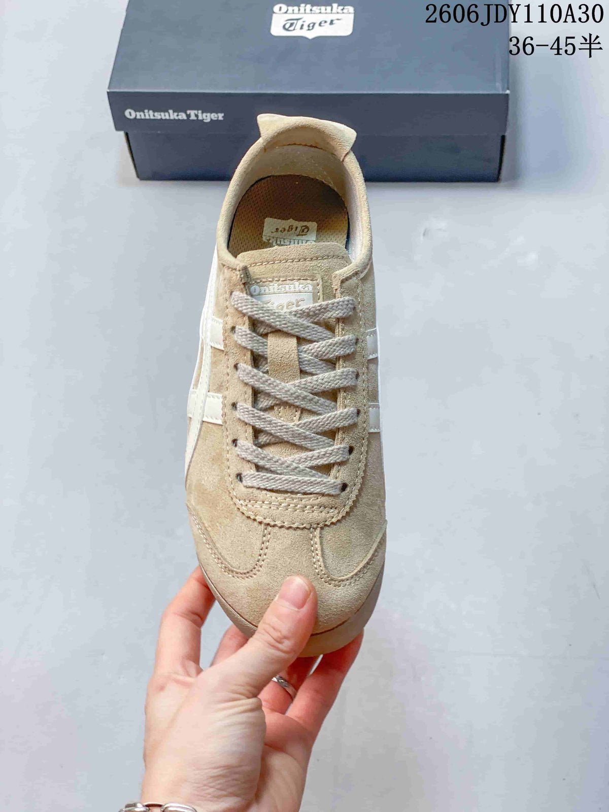Top view of a beige Onitsuka Tiger sneaker with gray laces and white side stripes