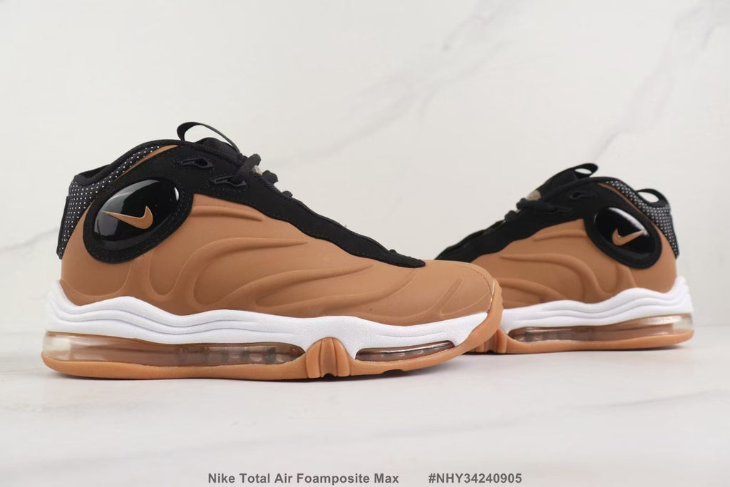 Side view of the brown and black sneakers showing the oval side logo and sculpted upper