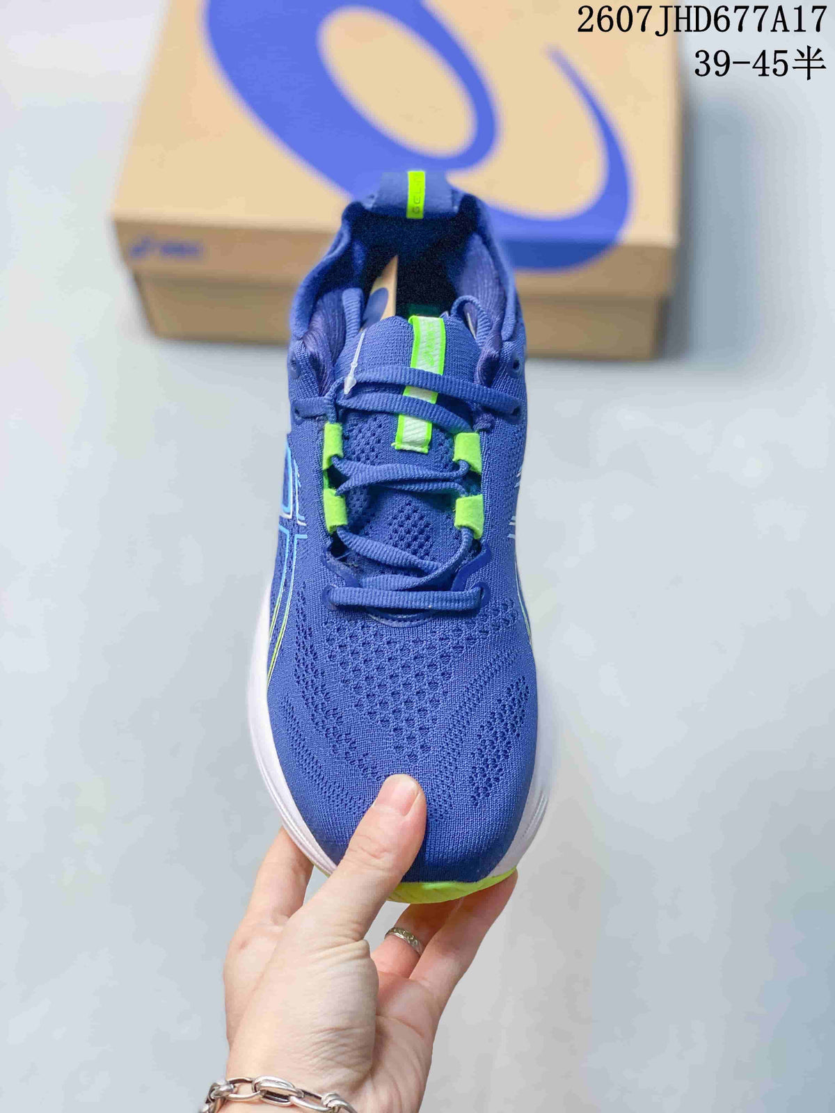Top view showing the blue textile-style upper, lace system and bright green lace details.