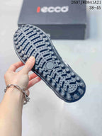 Close-up of the textured rubber outsole showing raised circular tread elements and grooves.
