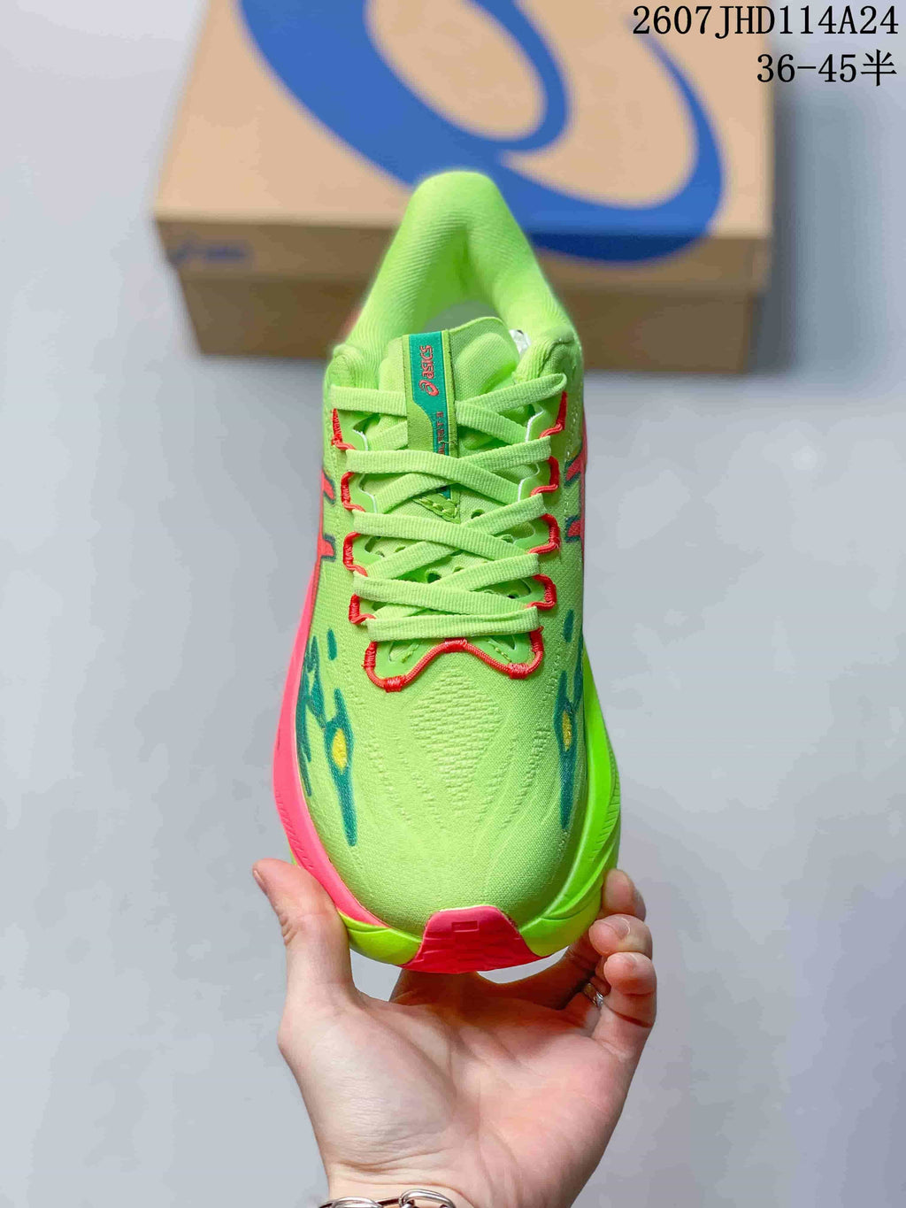 Top view showing the lace-up closure, lime green upper, and contrasting red and blue details.