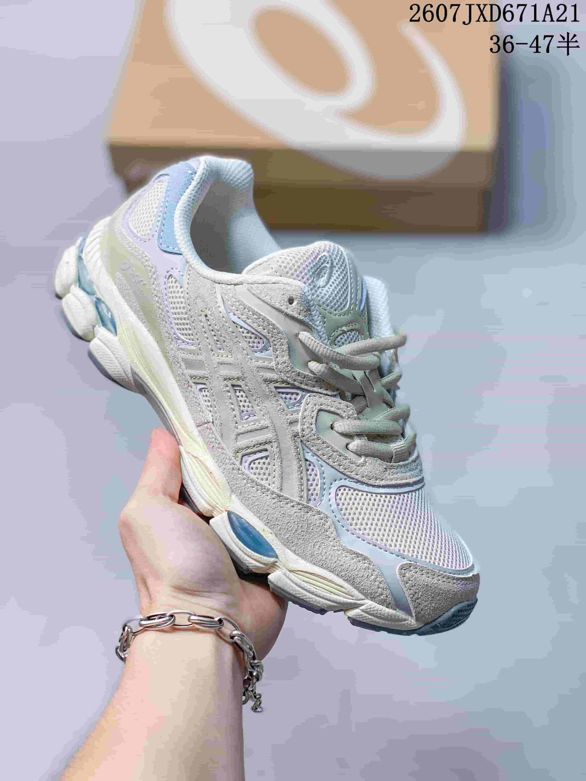 Light gray and pastel ASICS GEL-Kayano 14 sneaker with layered mesh panels.