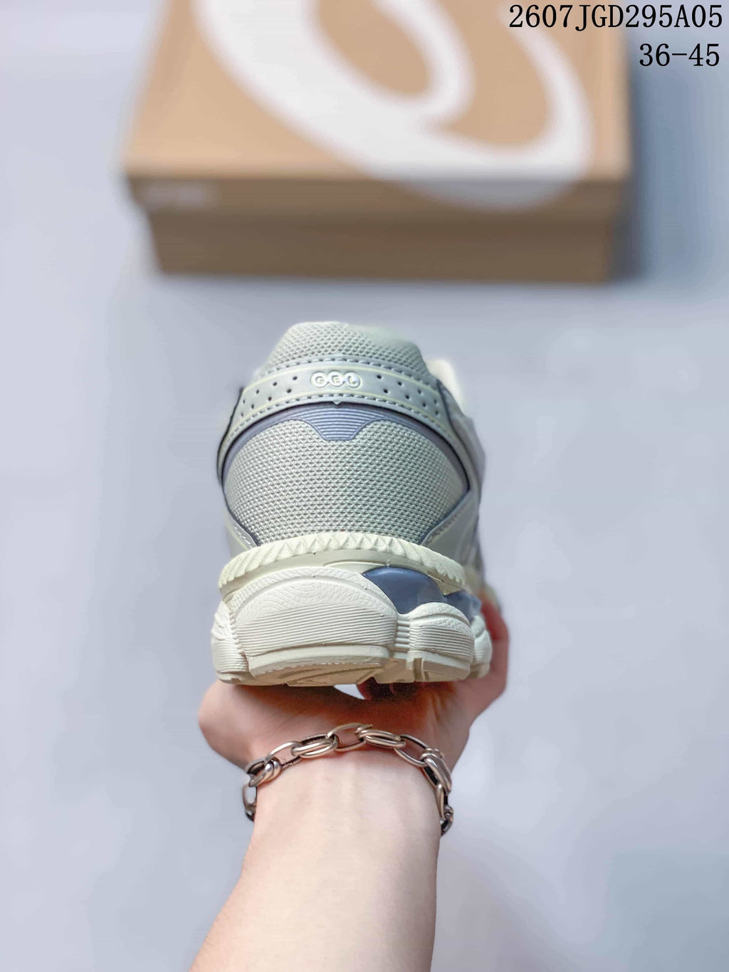 Rear view of the sneaker showing the padded heel collar, heel overlay, and layered outsole construction; overlay text shows style code 2607TGD295A05 and size range 36–45.