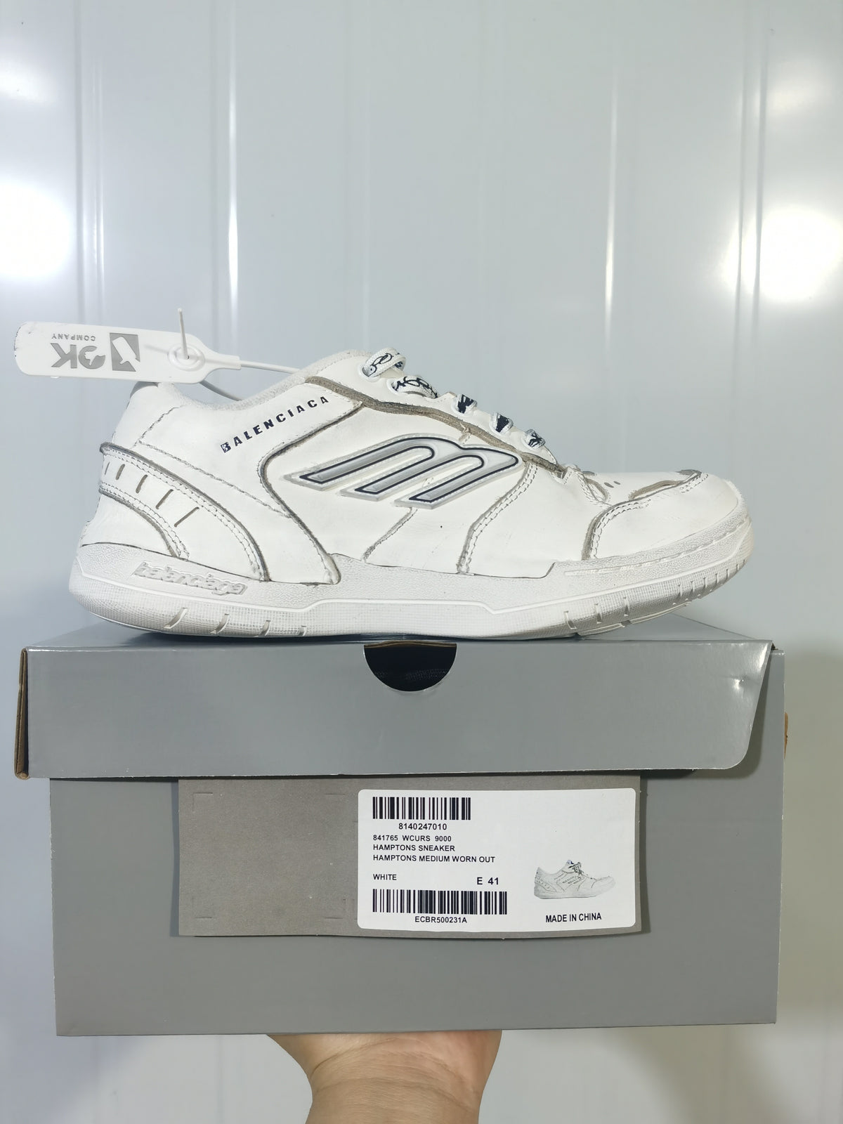 White Balenciaga Hampton sneaker displayed on its box; the box label shows “HAMPTONS SNEAKER,” color “WHITE,” and size “E 41.”
