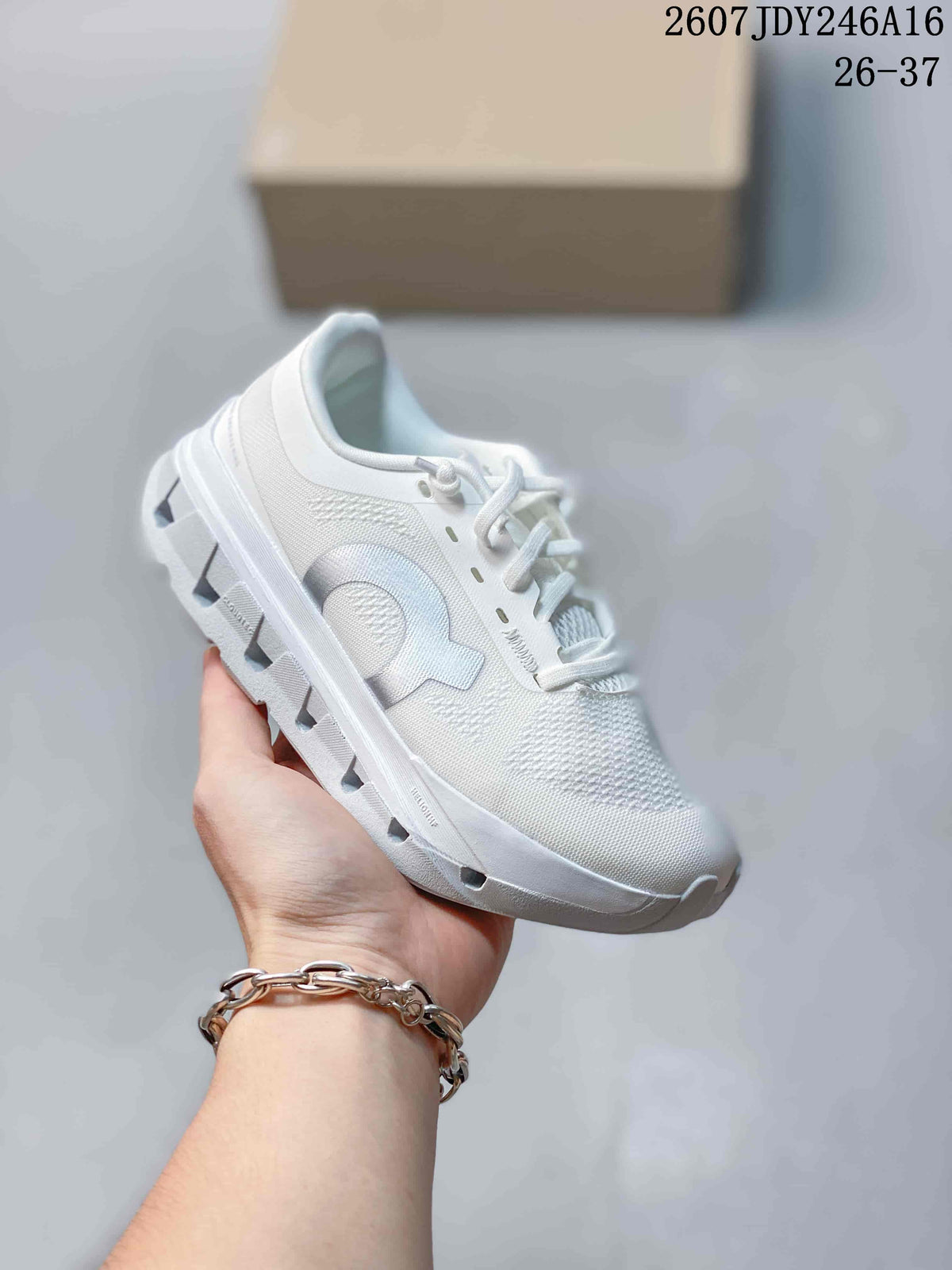 All-white On Cloudstratus 3 kids running shoe with matching laces and outsole.