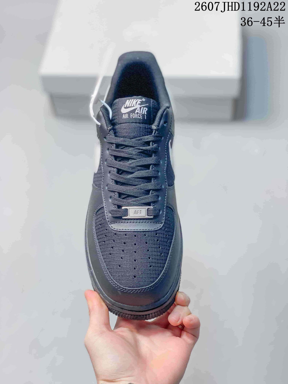Top view showing the perforated toe box, dark laces and branded tongue.