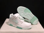 Angled view of one sneaker beside its outsole, showing pale mint traction sections and circular tread details.