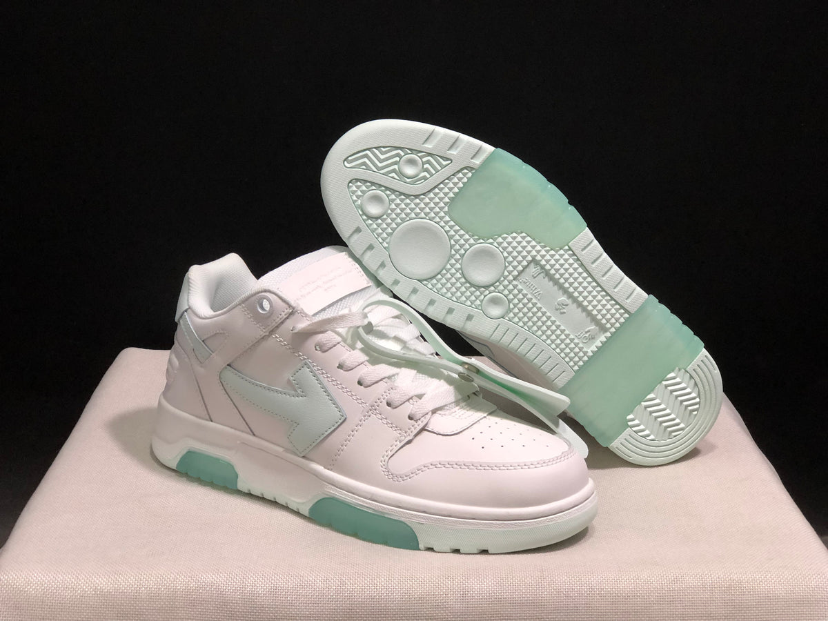 Angled view of one sneaker beside its outsole, showing pale mint traction sections and circular tread details.