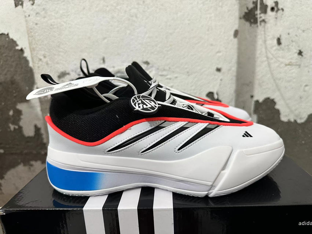 Side view of a white basketball shoe with blue heel panel and black three-stripe details