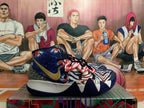 Blue, white, and red patterned high-top basketball shoes shown from a side angle.