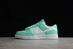 Opposite side profile showing the low-top silhouette, white Swoosh, mint green overlays, and layered sole.