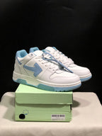Pair of white and light blue Off-White Out Of Office low-top sneakers displayed on a green shoebox; the box label shows size 41.