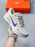 Off-white Nike Journey Run sneaker with a purple logo and contrasting outsole detail.