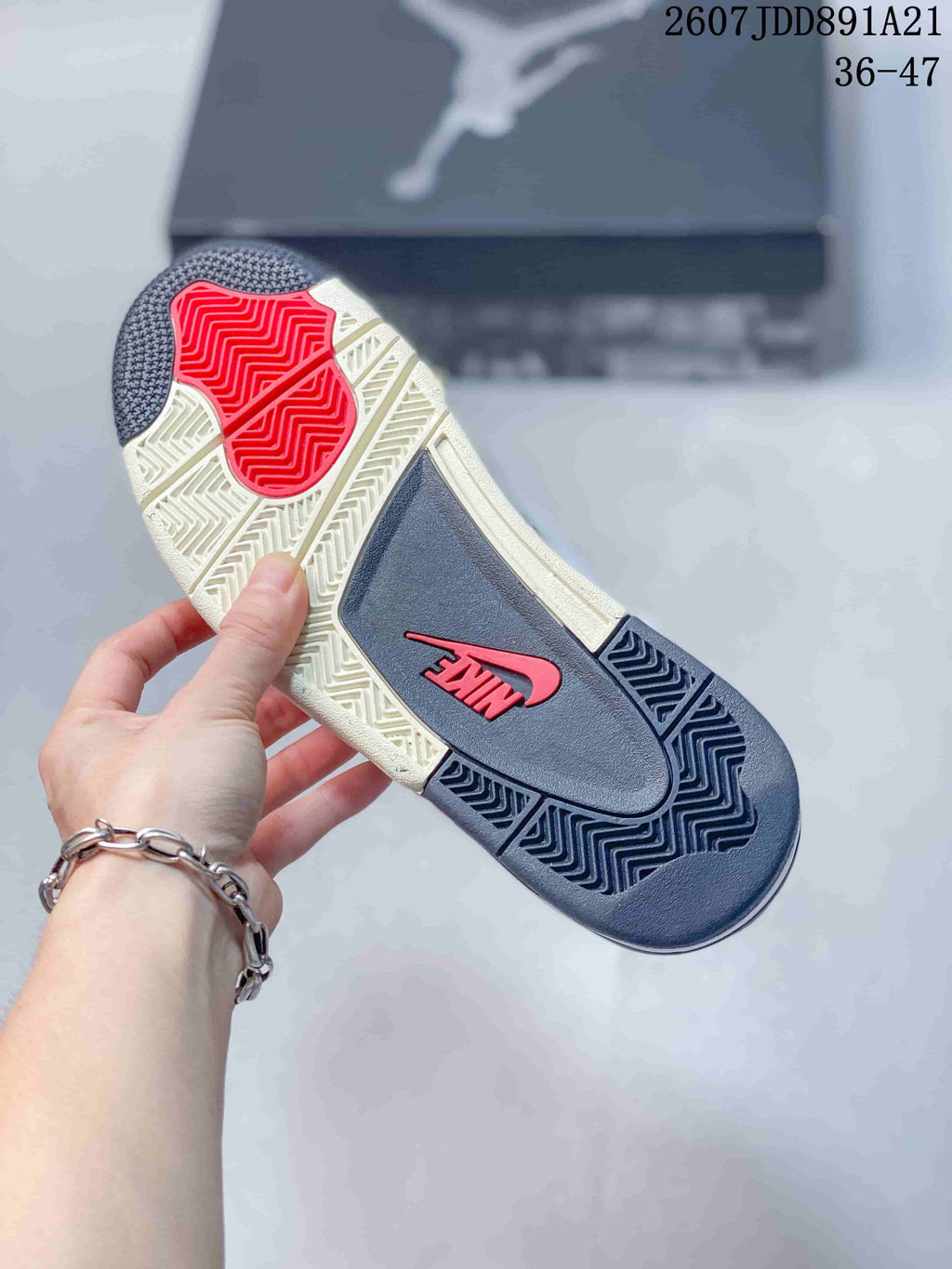 Outsole view showing the patterned rubber tread and red Nike branding.