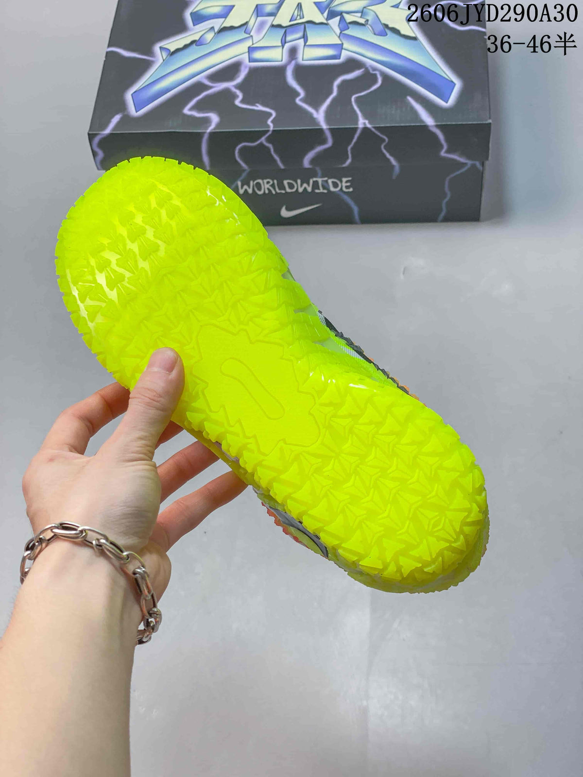 Close-up of the textured neon yellow outsole on a Nike Ja 3 shoe.