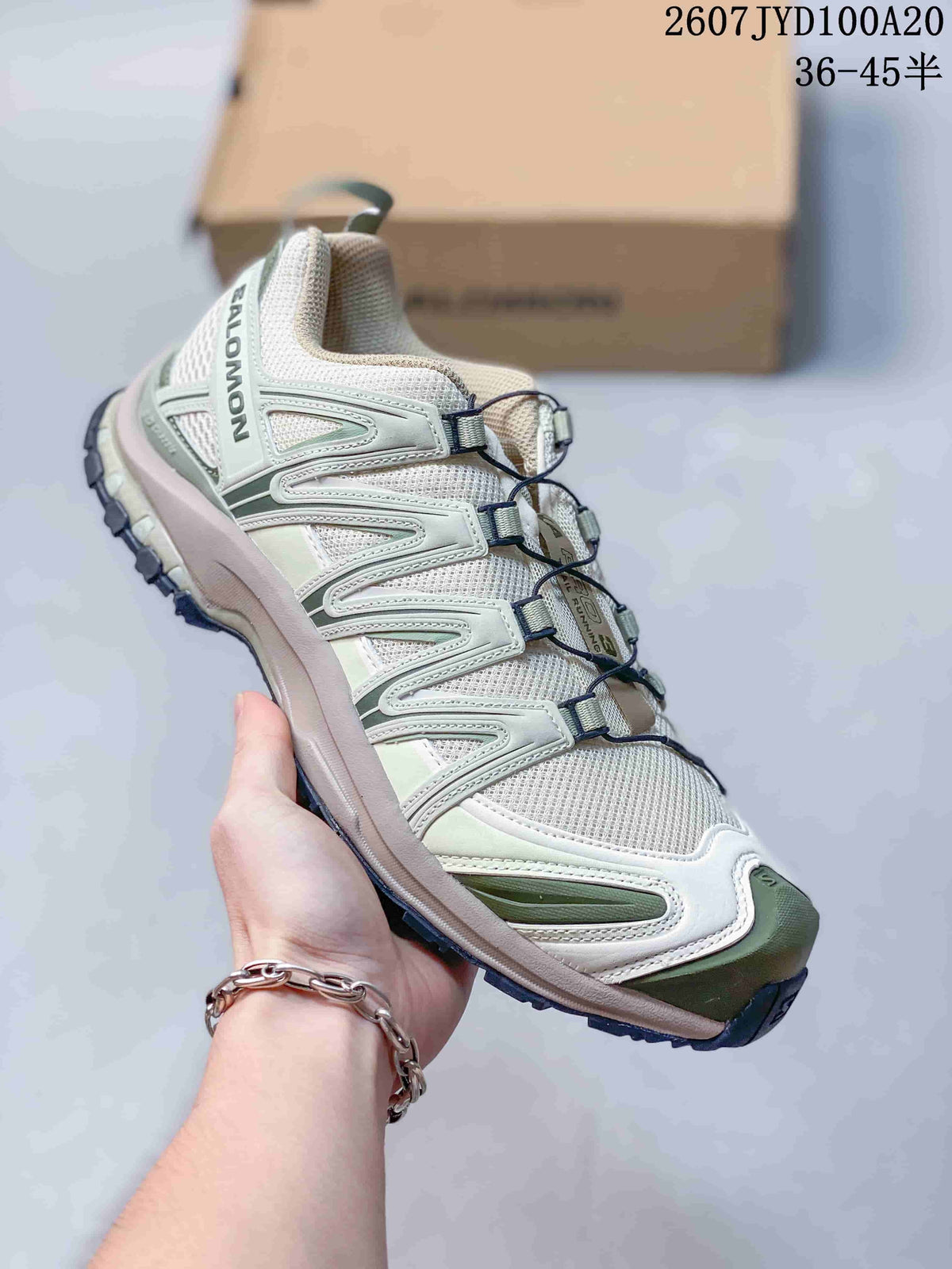 Salomon XA PRO 3D trail shoe in a pale green, white and gray colorway, shown from the side and front.
