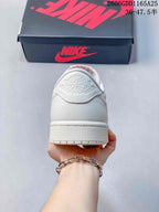 Rear view of the white sneaker showing the embossed Air Jordan heel detail.
