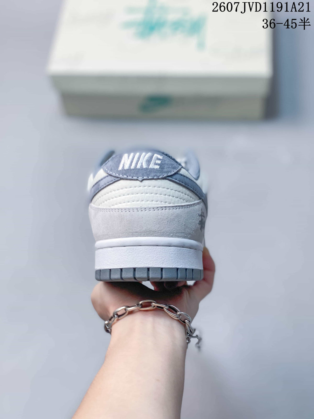 Rear view of the sneaker showing the padded collar, heel tab with Nike branding, white midsole and gray outsole.