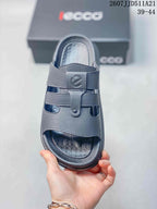 Top view of a gray sandal showing the open toe, adjustable straps, and textured footbed.