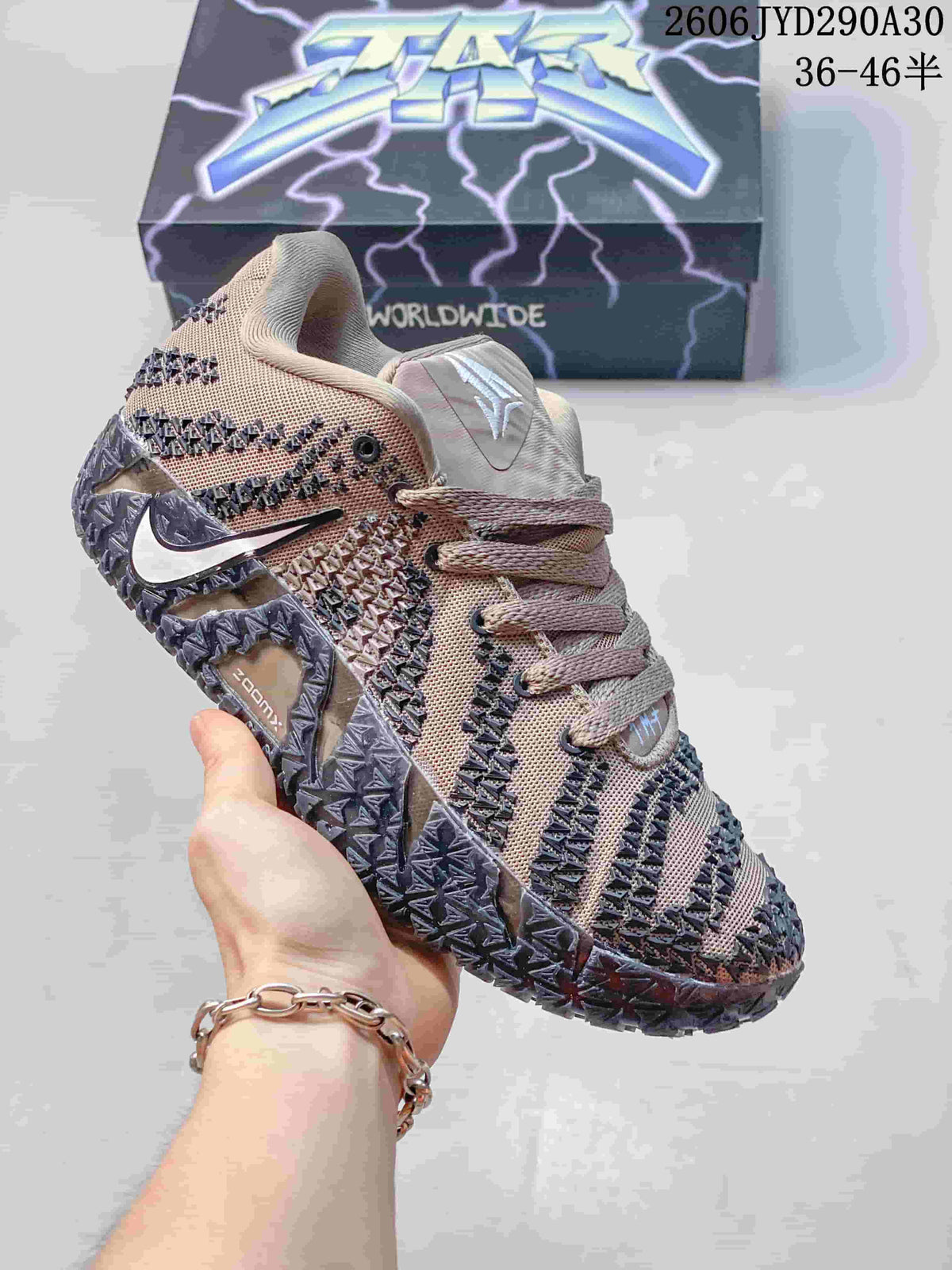 Taupe and dark gray Nike Ja 3 basketball shoe with a white side logo