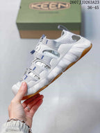 Side view highlighting the open-panel upper, quick-lace system, and thick sole.