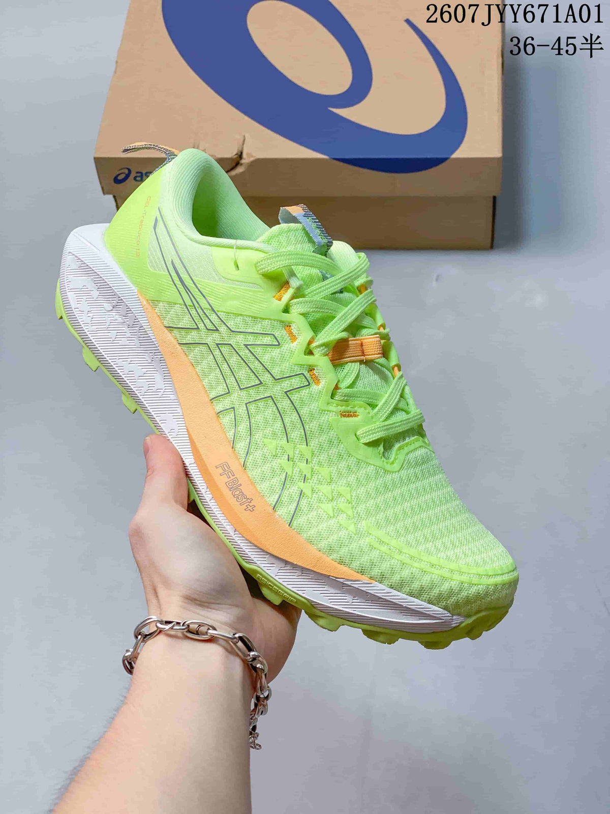 Bright lime ASICS GEL-TRABUCO 13 trail shoe with pale orange and white accents