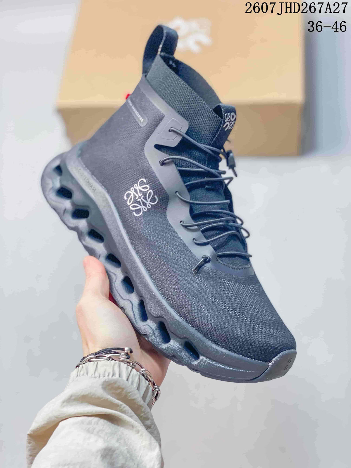 Angled side view of a dark gray LOEWE x On Cloudtilt sneaker showing white branding, high ankle collar, lace system and segmented outsole.