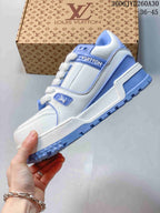 Side view of the white and blue low-top sneaker
