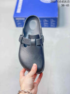 Top view of the black closed-toe sandal showing the rounded toe, molded footbed and adjustable strap.