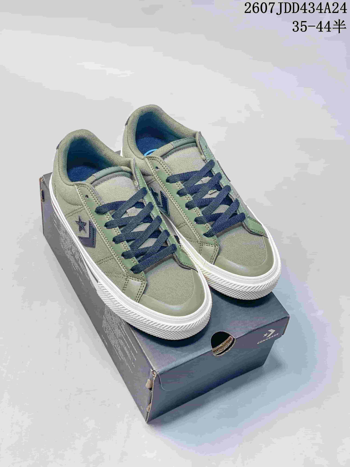 Pair of muted green low-top sneakers with dark navy laces displayed on a branded shoe box; overlay text shows style code 2607JDD434A24 and size range 35–44.5.