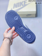 Close-up of the blue rubber outsole showing circular traction grooves.