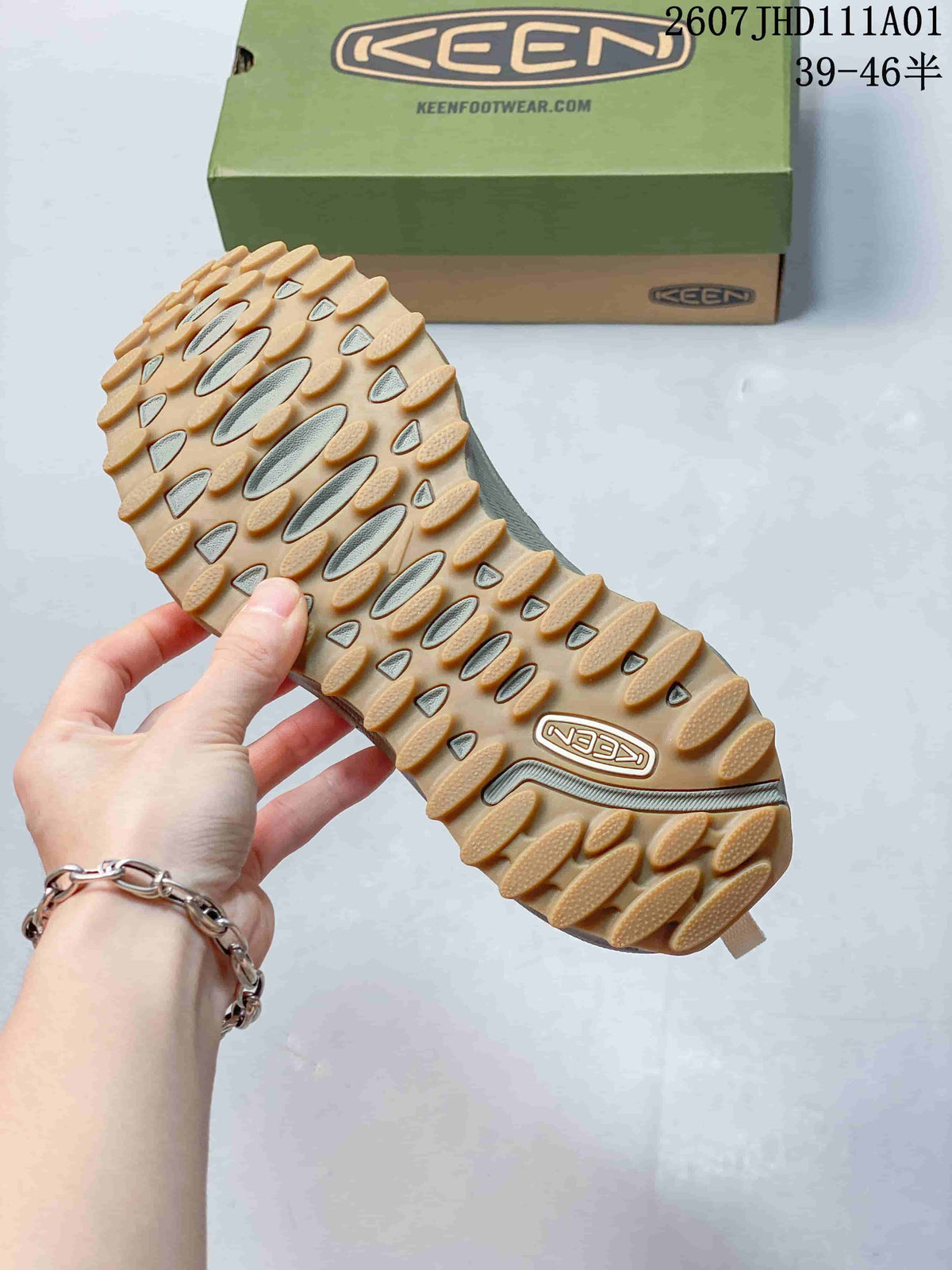 Close-up of the tan-colored lugged outsole on a KEEN Zionic ADV shoe.