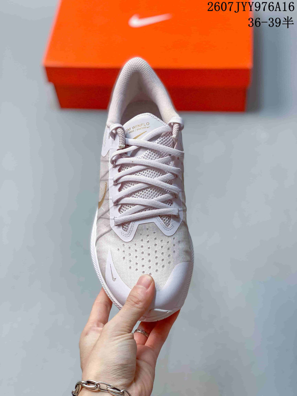 Top view of the sneaker showing the laces, perforated toe area, and padded tongue.