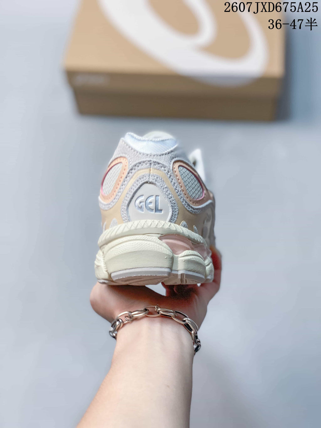 Rear view of an ASICS GEL-NYC sneaker showing the padded heel and GEL branding.