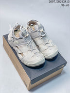 Pair of light gray The North Face outdoor sandals displayed on a shoebox, with style code 2607JDD293A13 and size range 36–45 visible above.
