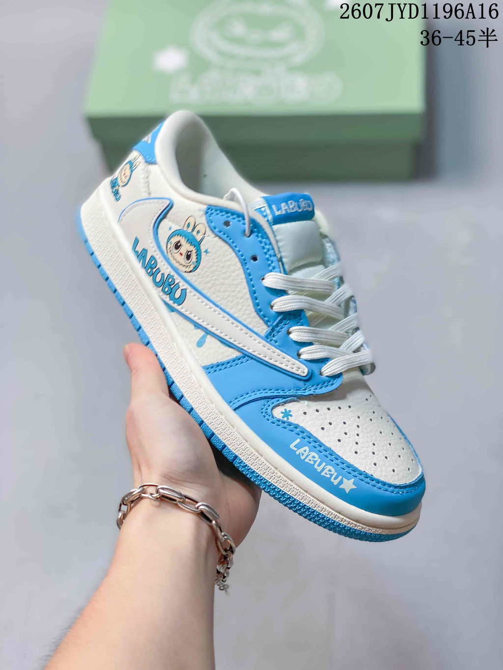 Angled side view showing the Labubu character graphic, Labubu lettering, Swoosh, blue overlays, and white midsole.