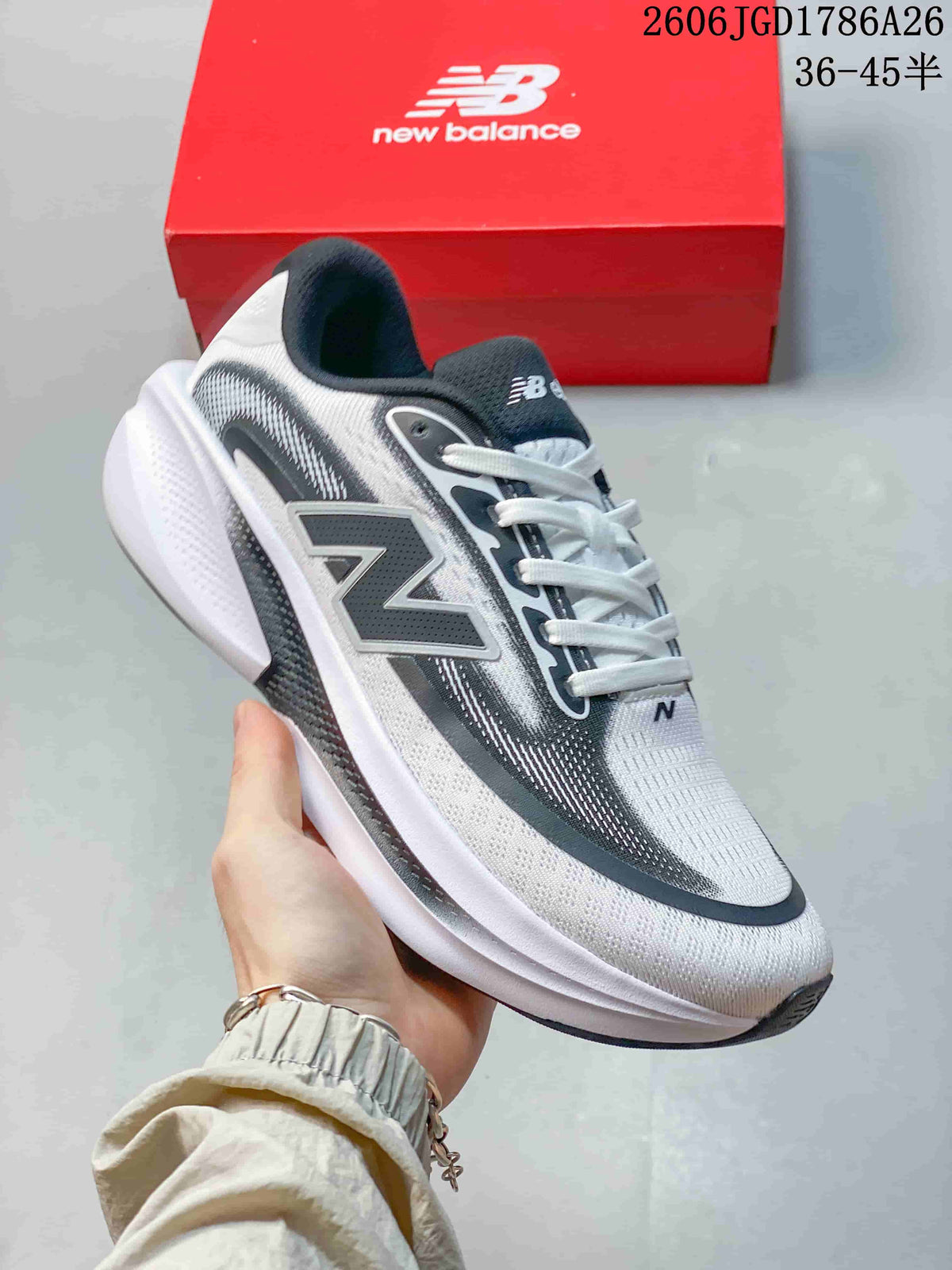 Close-up side view of a white and dark gray New Balance Ellipse V1 shoe