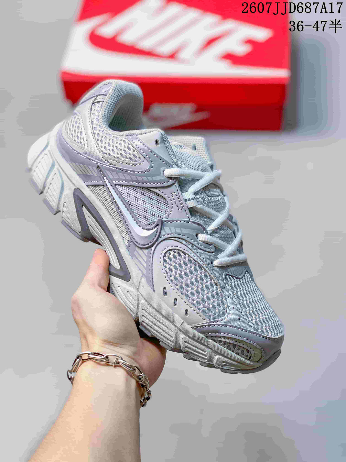 Light gray and white Nike V5 RNR sneaker with lavender-gray overlays.
