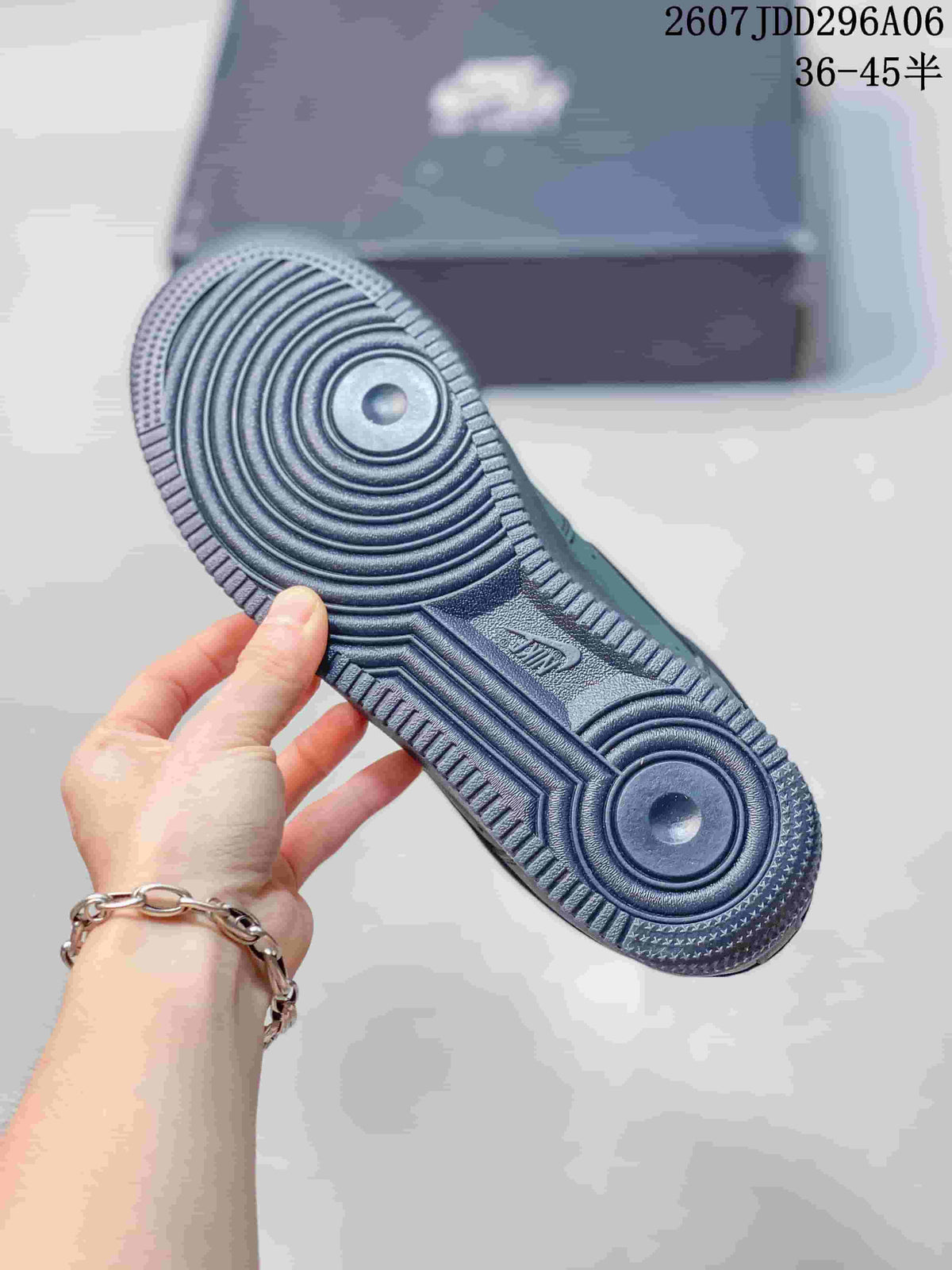 Close-up of the sneaker outsole showing concentric circular grooves and textured traction details.