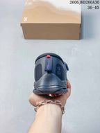 Rear view of a dark navy On Cloudnova Moon sneaker showing the heel.