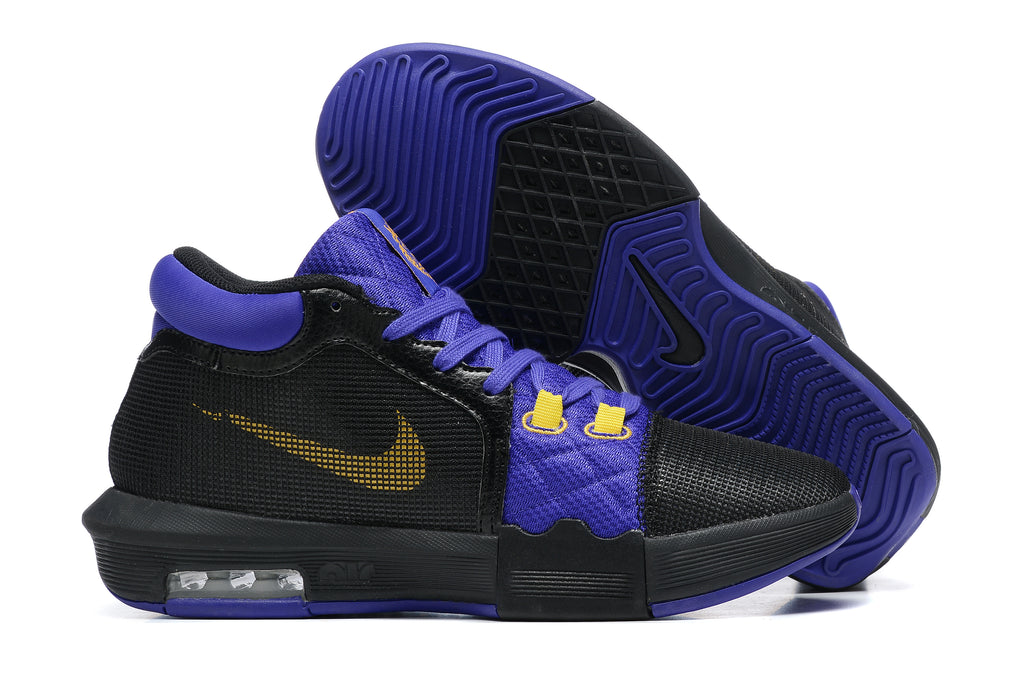 Black low-top basketball shoes with purple and yellow accents, shown from the side and outsole.