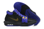 Black low-top basketball shoes with purple and yellow accents, shown from the side and outsole.