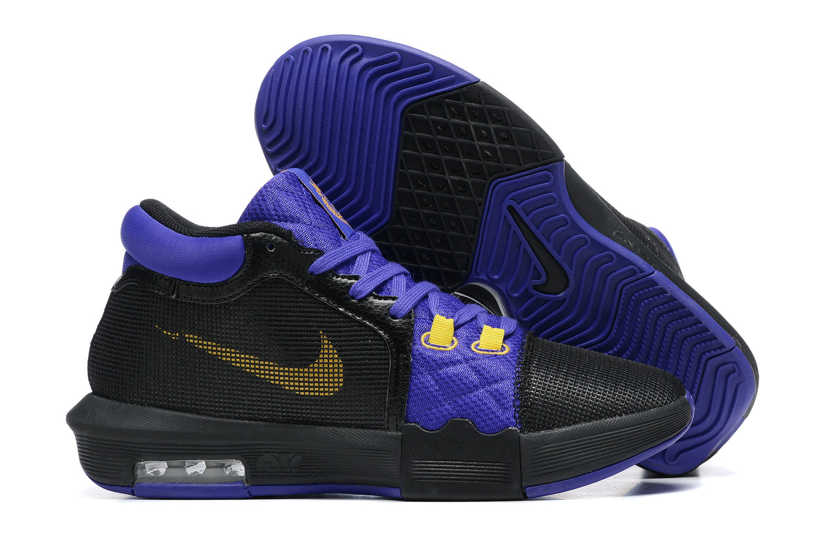 Black low-top basketball shoes with purple and yellow accents, shown from the side and outsole.