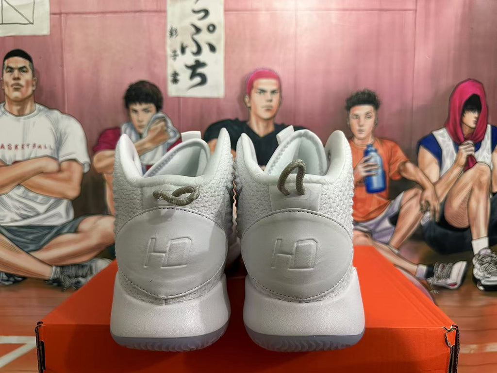 Rear view of white Nike basketball shoes with silver details