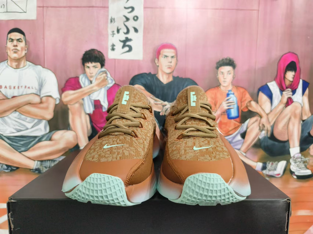 Front view of brown Nike sneakers with tonal laces, small mint-tone Swooshes, and pale mint-colored outsole accents.