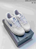 Pair of white and blue Nike Air Max 90 sneakers displayed on a shoebox; the image also shows the text "2606 JJD416A26" and "40–46".