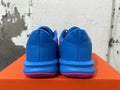 Rear view of blue and pink Nike Precision 7 basketball shoes